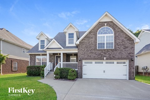 a brick house with a white garage door
