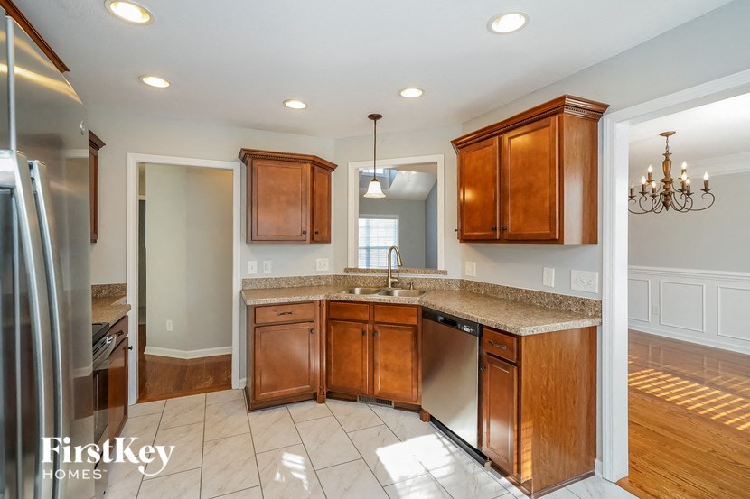 a kitchen with wooden cabinets and a counter top
