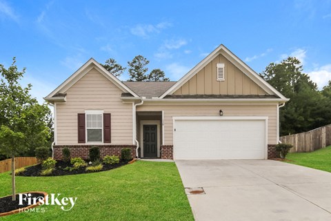 a beige house with a white garage door