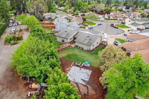 A residential area with a large house in the center.