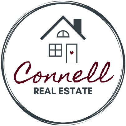 logo for a real estate agency with a house and the real estate