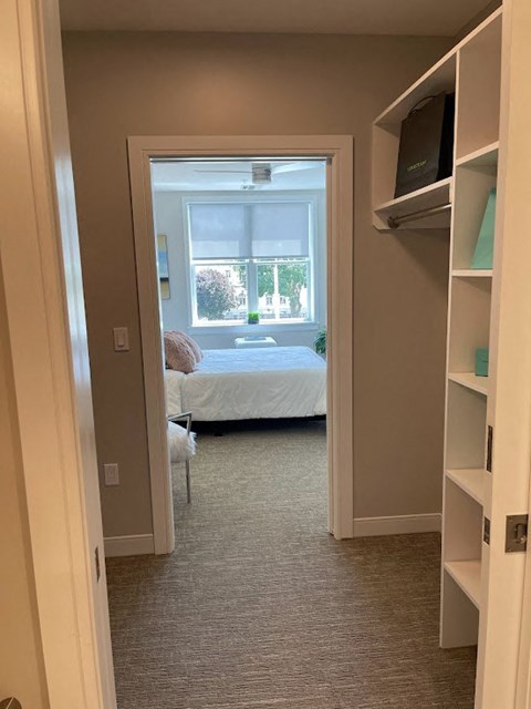 a room with a bed and a window in it