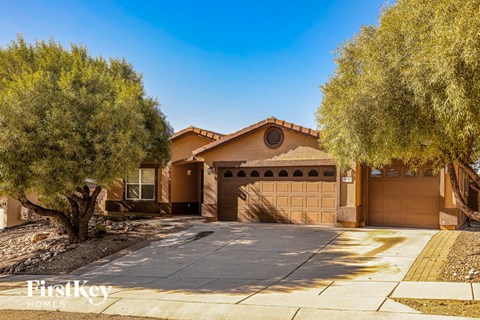 A house with a brown garage door is for sale.