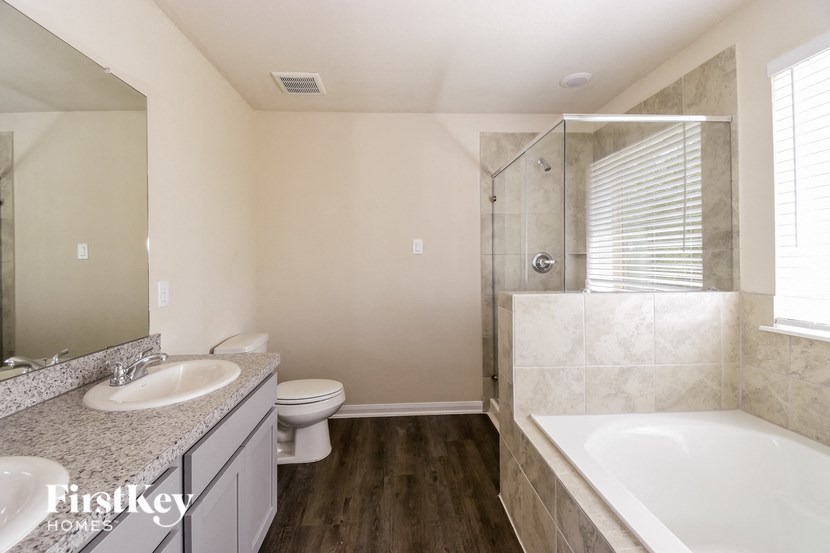 a bathroom with a sink toilet and a shower