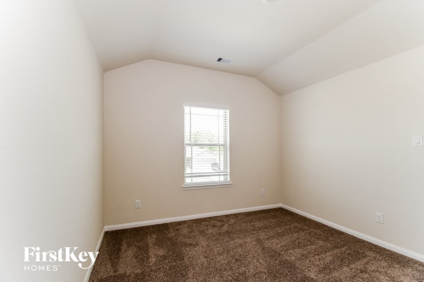 a room with carpet and a window