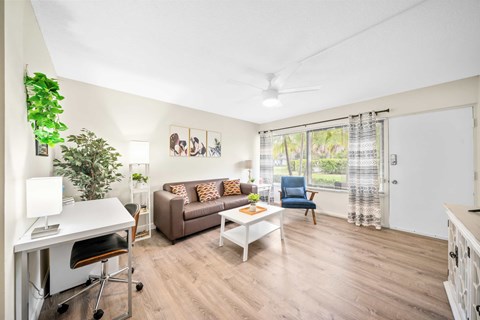 a living room with a couch and a table