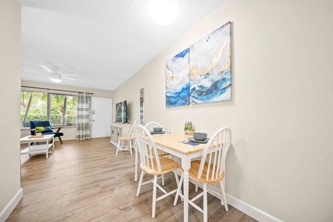 a dining room with a table and chairs
