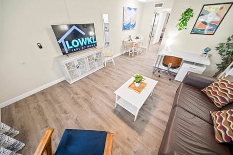 a living room with a couch and a table and a television