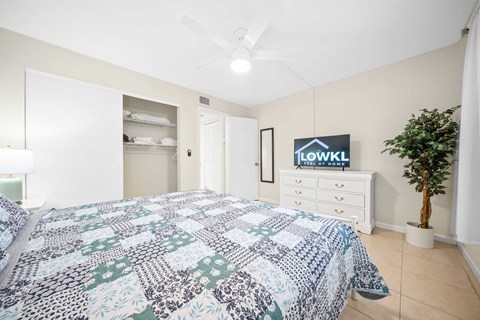 a bedroom with a bed and a closet