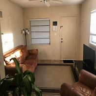 a living room with a couch and a tv