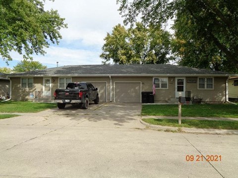 a truck is parked in front of a house