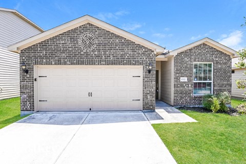 a house with a white garage door on a driveway
