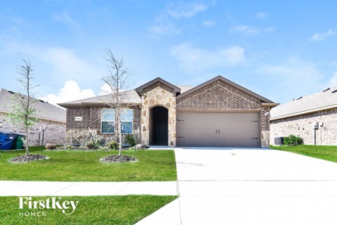 a house with a driveway and a garage door