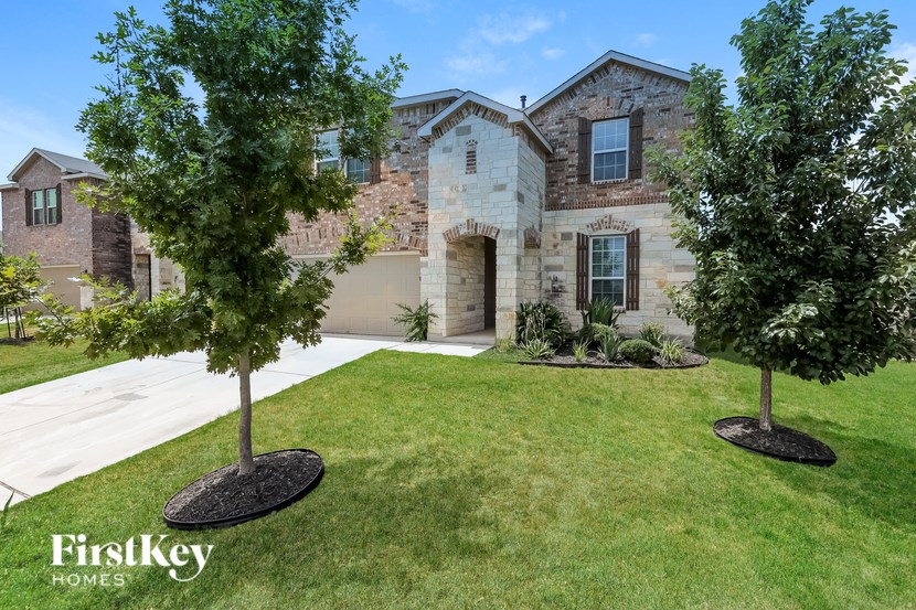A house with a tree in front of it.