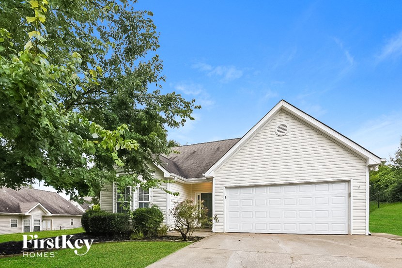 a white house with a white garage door