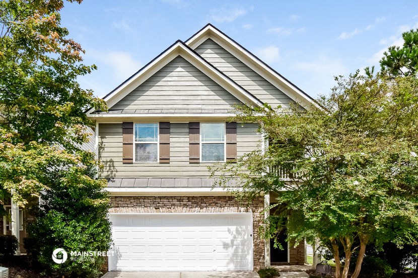 a house with a white garage door in front of it