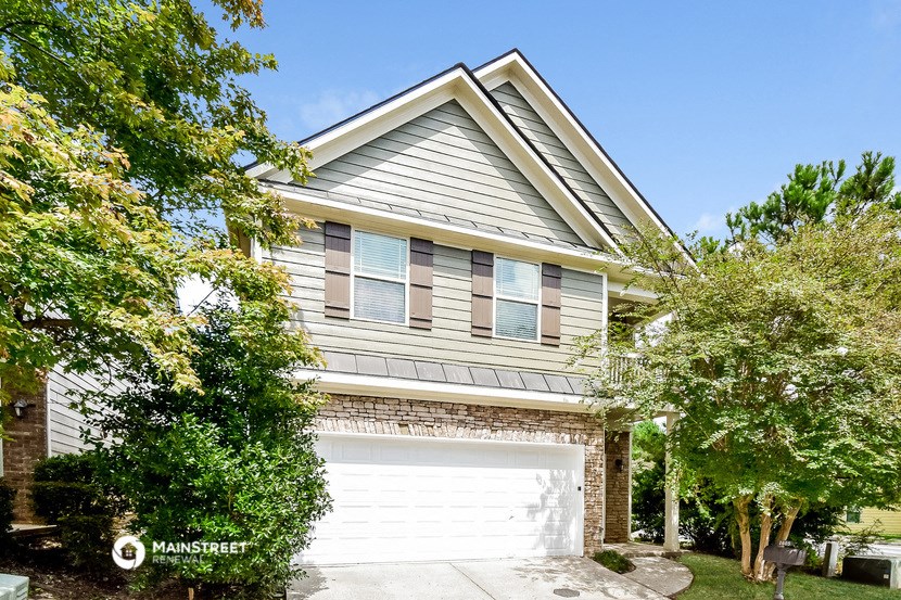 a white garage door in front of a house