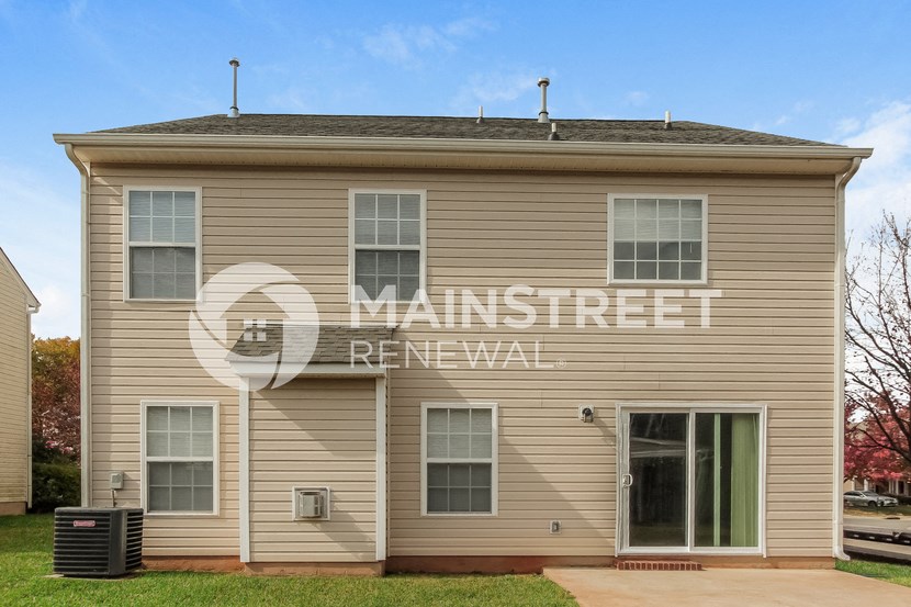 a house with a large sign on the side of it