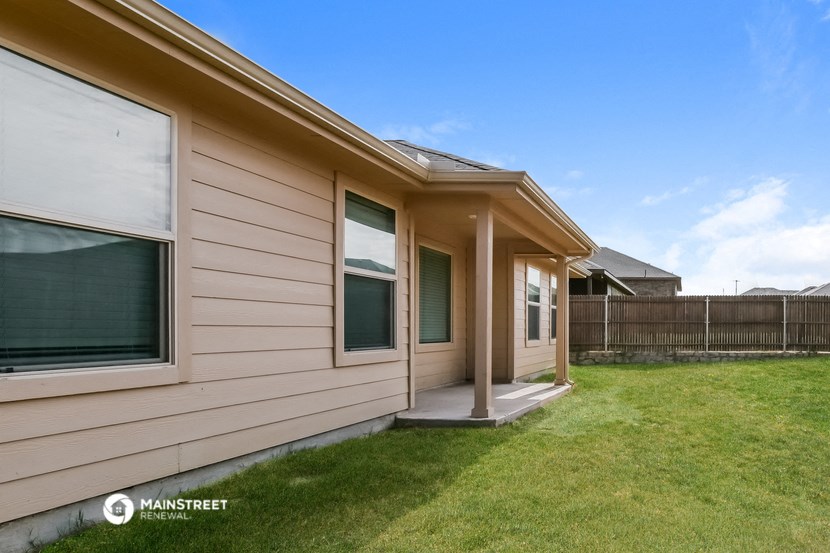the outside of a house with a lawn and a porch