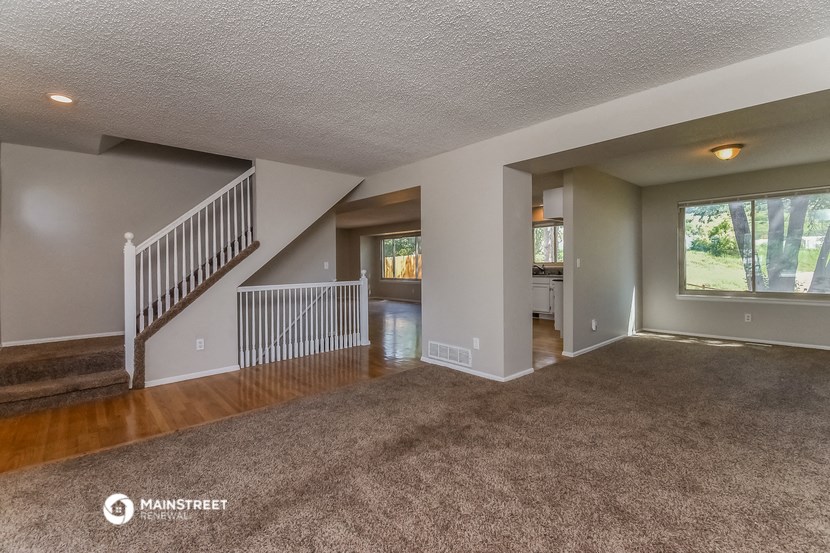 the living room and dining room are open to the kitchen
