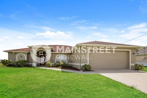 a house with a lawn in front of it