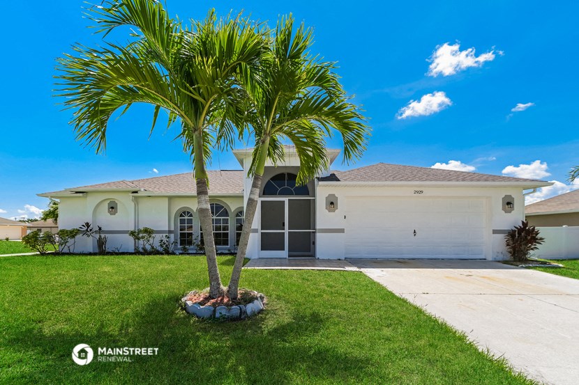 a house with a palm tree in front of it