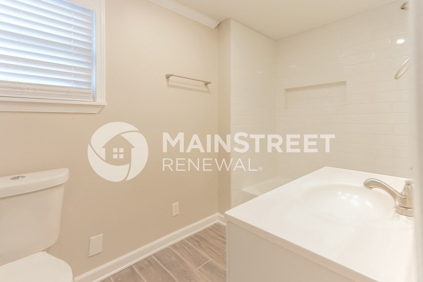 bathroom of a renovated bathroom with sink and toilet
