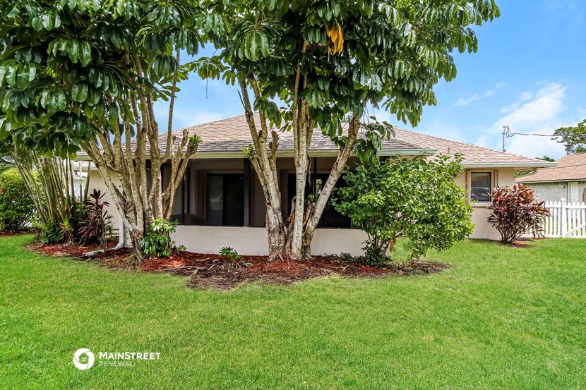 a house with trees in the front of it