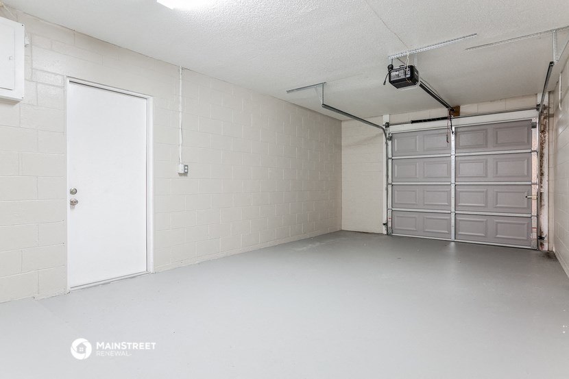 the inside of a garage with a door