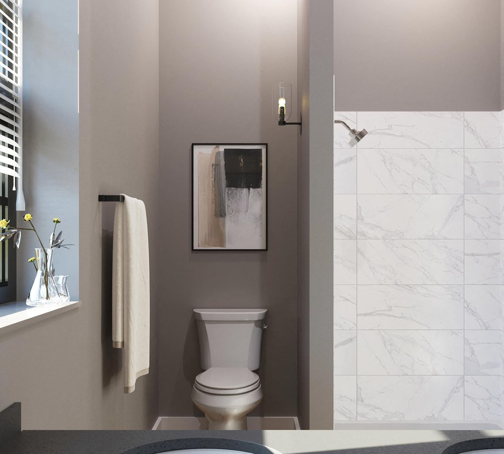 a small bathroom with a toilet and a shower