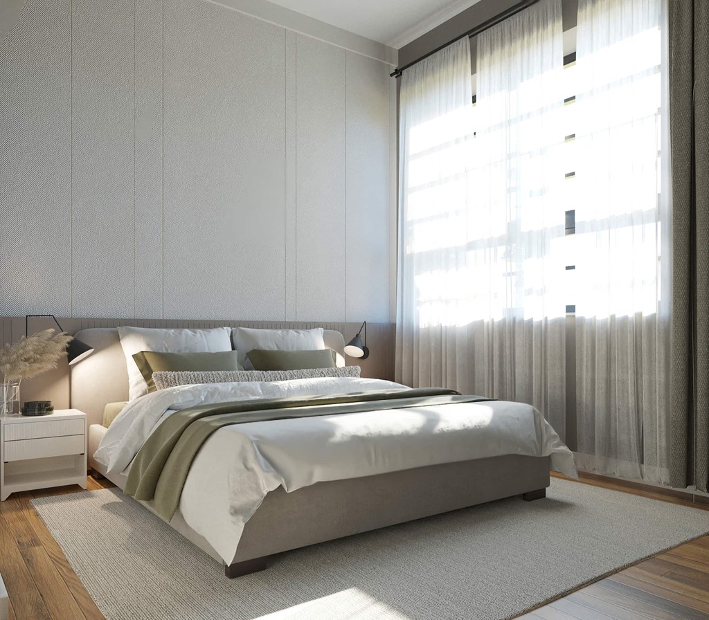 a bedroom with a bed and a large window