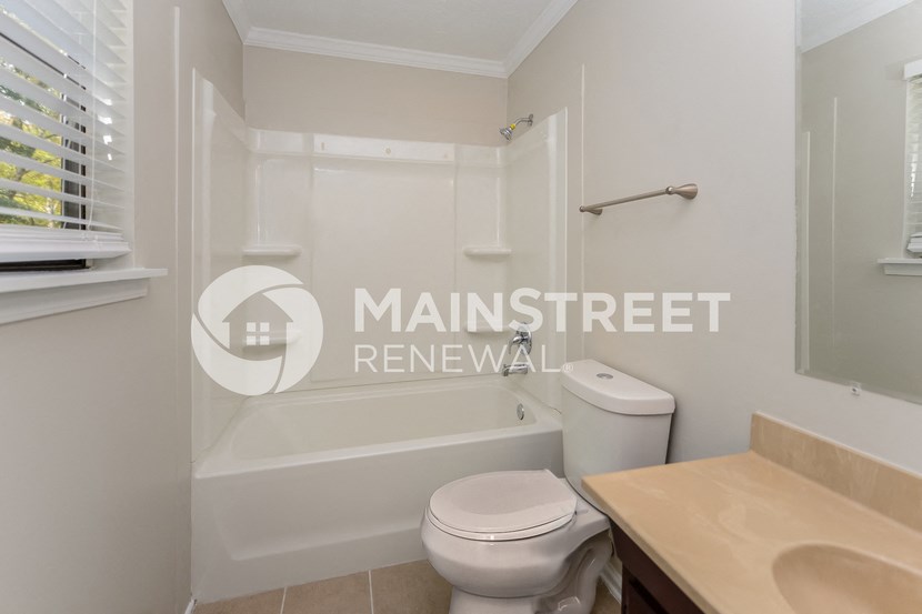 a renovated bathroom with a shower and a toilet