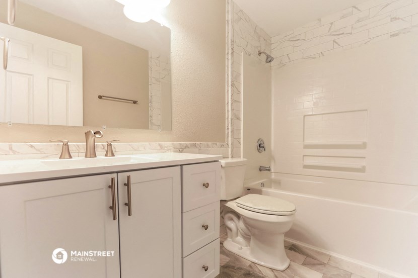 an image of a bathroom with a toilet and a sink