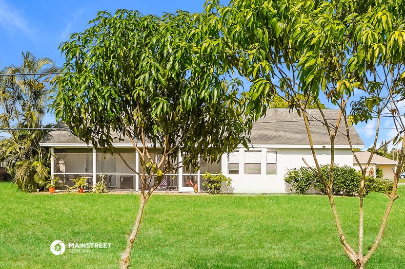 a house with a tree in front of it