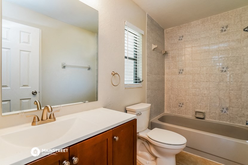 a bathroom with a sink toilet and a tub