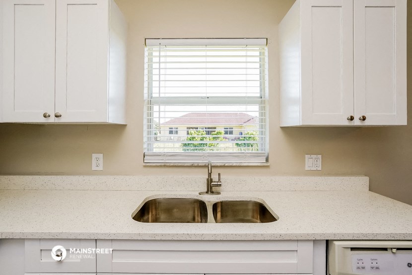 a kitchen with a sink and a window