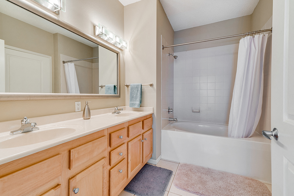 Full bathroom with large mirror and two sinks