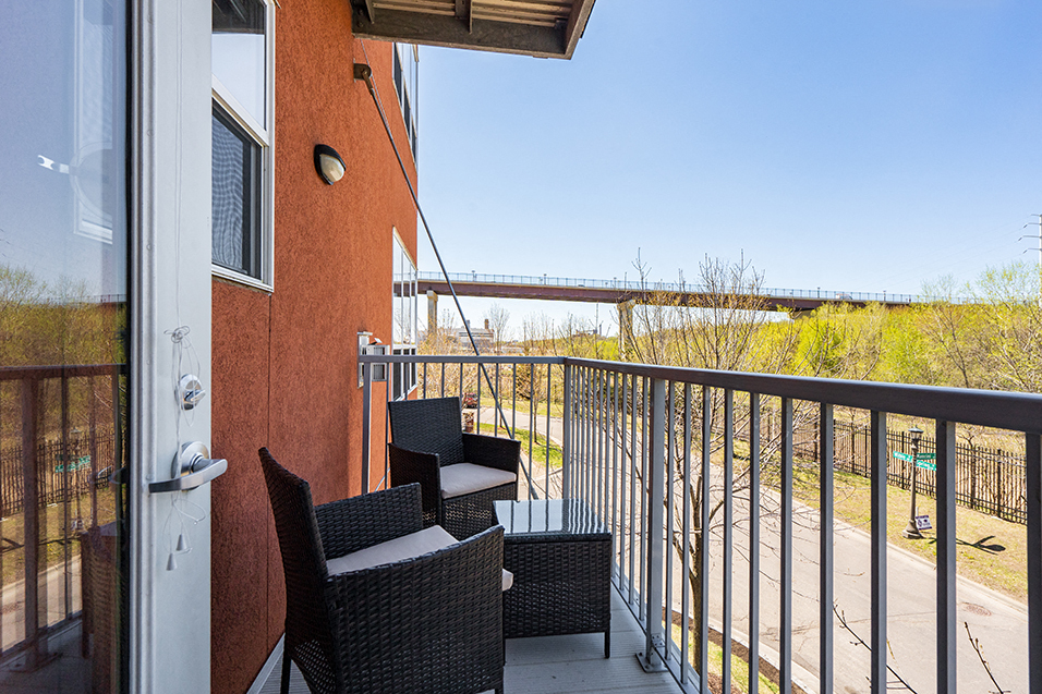 Personal balcony with two chairs and a small table