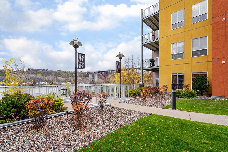 a view of a building with a river in the background