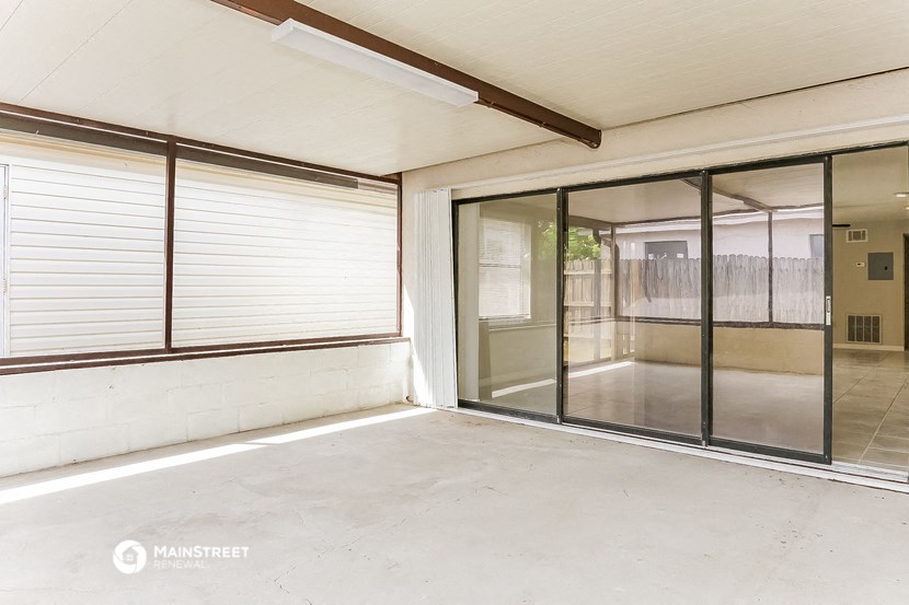 a living room with sliding glass doors to a patio
