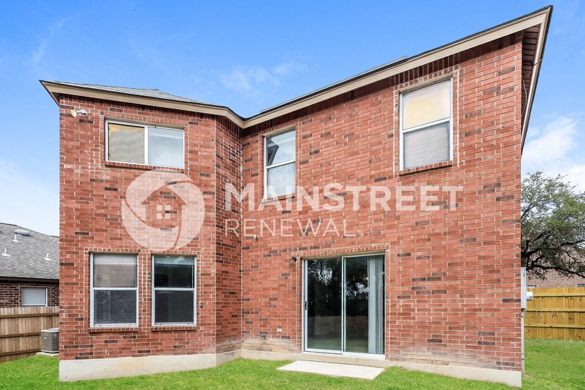 an old brick building with a mural on the side of it