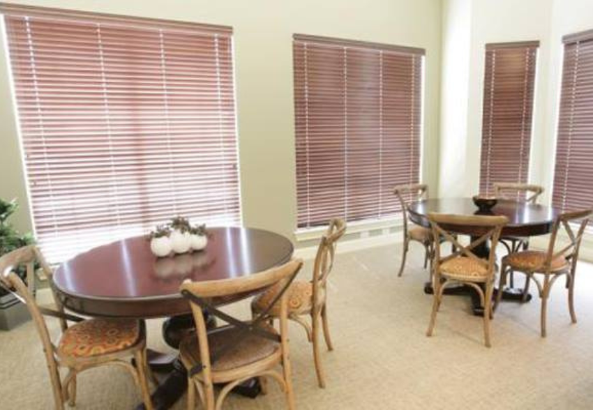 a dining room with a table and chairs