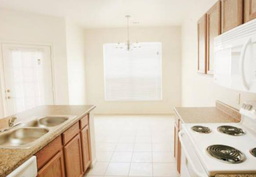 a kitchen with a stove and a sink