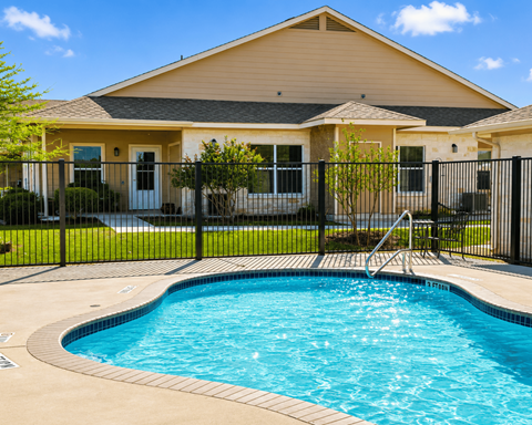A house with a pool in the backyard.