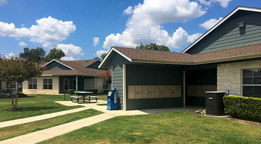 a house with a picnic table outside of it