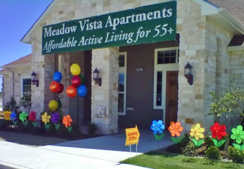 the office apartments is decorated with colorful flowers and balloons