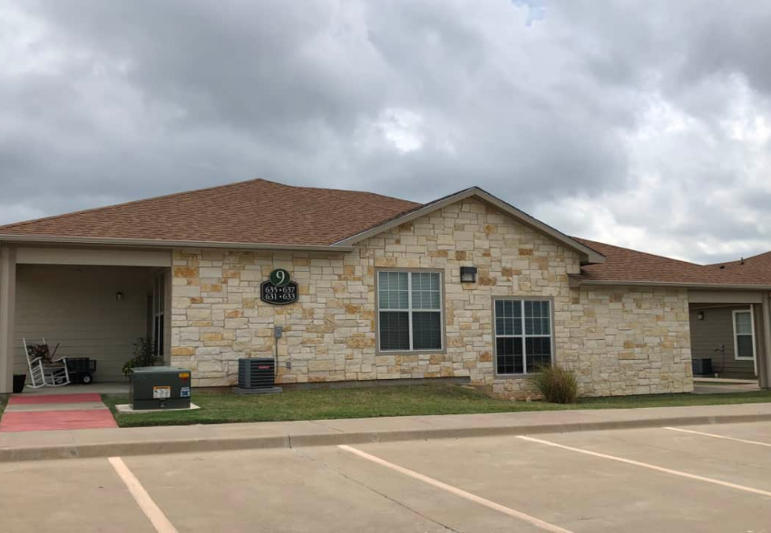 a brick building with a sign on the side of it