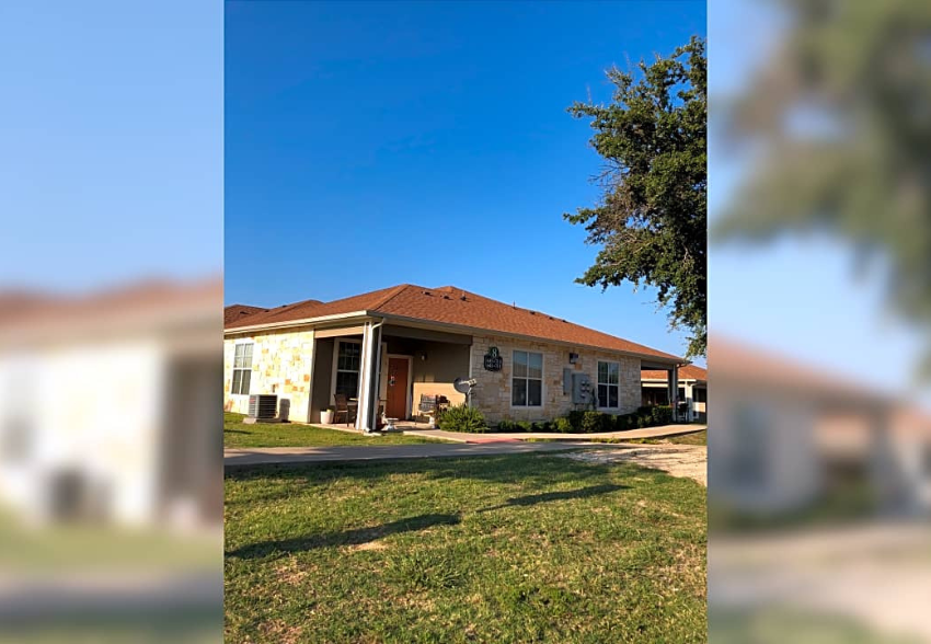 a house with a red roof and a yard