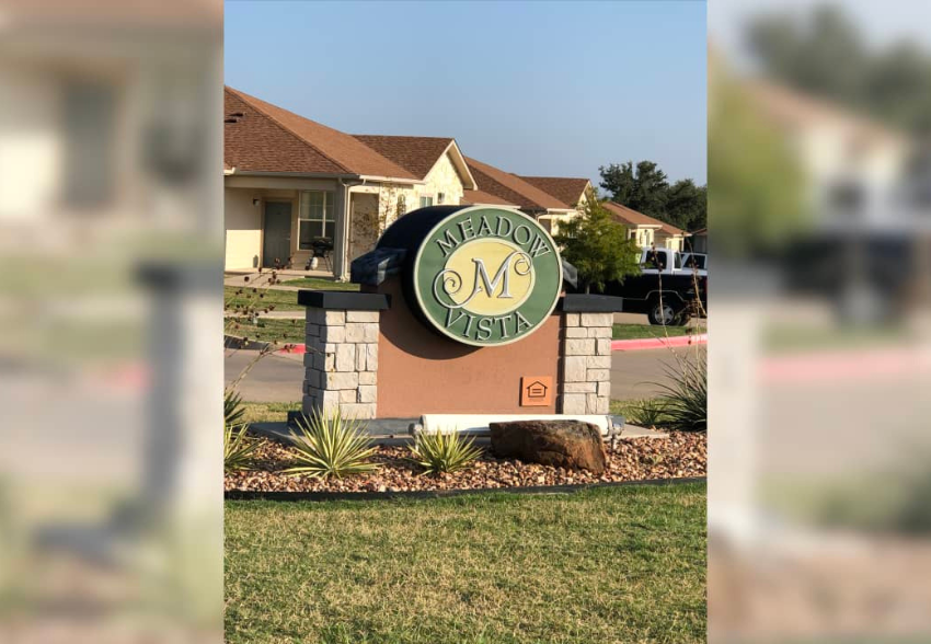 the sign in front of our house