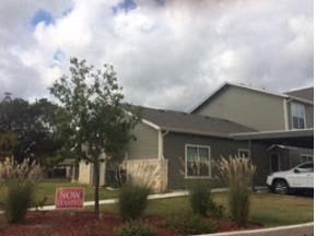 a house with a red sign in front of it